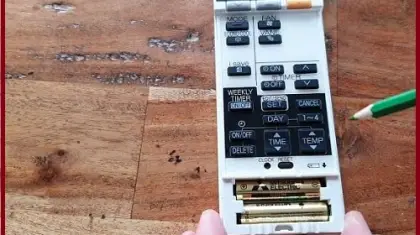 How to change battery in Mitsubishi electric Remote?